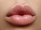 Closeup kiss natural lip makeup. Beautiful plump full lips on female face. Clean skin, fresh make-up. Spa tender lips