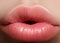 Closeup kiss natural lip makeup. Beautiful plump full lips on female face. Clean skin, fresh make-up. Spa tender lips