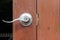 Closeup of knob on wooden door