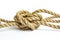 Closeup knot of tangled jute rope on white background