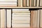 Closeup of a large group of used books on a bookshelf