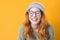 Closeup laughing young woman with eyes closed, isolated on yellow background. Beautiful female person with laugh expression