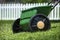 Closeup of lawn spreader in grass yard used for applying grass seed, fertilizer, herbicides,