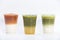 Closeup of layered drinks iced tea group thai milk tea matcha latte and yuzu green tea in plastic glass isolated white background