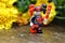 Closeup Lego minifigure of the Harley Quinn from Batman and Harley Quinn on a rock