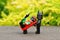 Closeup of the Lego minifigures of The Batman and Robin superheroes on the ground