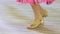 Closeup, legs of children in shoes for ballroom dancing, dancing on the floor