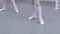 Closeup legs of little ballerina in classical ballet dance studio