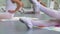 Closeup legs of little ballerinas group in white shoes practicing on floor in ballet school