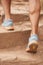 Closeup, legs and person hiking steps in nature for fitness, workout and exercise training for wellness, health or