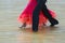 Closeup of The Legs of Professional Dancing Couple in Motion In