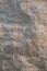 Closeup limestone rock face showing weathered strata Geology walpaper or background