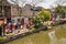 Closeup of lines of drying colorful laundry along canal of Tongli, China