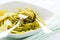 Closeup of linguine pasta with pesto genovese and potatoes