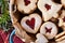 Closeup of Linzer Christmas cookies filled with marmalade