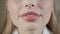 Closeup lips. portrait of attractive smiling woman blond. In a white bathrobe after the procedure. Cosmetology and SPA