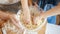 Closeup of little boy mixing dough in big glass bowl. Children cooking with parents, little chef, family having time