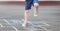 Closeup of little boy`s legs and hopscotch drawn on asphalt