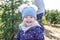 closeup of little girl having fun at christmas tree farm in winter