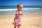 Closeup Little Girl in Pink Cries with Joy by Wave Surf