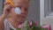 Closeup little girl try piece of wedding cake decorated with roses