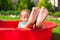 Closeup of little kid\'s legs in small red pool