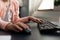 Closeup of little schoolkid hands using computer for home schooling