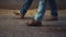 Closeup livestock workers legs walking wooden shed. Agricultural team at work.