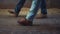 Closeup livestock workers legs walking wooden shed. Agricultural team at work.