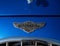 Closeup of the logo of an old blue Panther Lima sports car