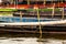 Closeup of long tailed boat mooring on the shore.