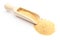 Closeup of loose garlic on wooden spoon. White background