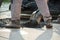 Closeup low angle view of worker arranging fresh asphalt mixture