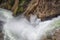 Closeup of Lower falls Yellowstone river. Raging waters. Spray from waterfall.