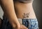 Closeup of lower hip tattoo of a woman