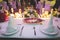 Closeup of a luxuriously decorated table with candles and flowers for a party