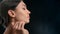 Closeup luxury brunette female model stroking perfect skin chin neck enjoy cosmetology procedure