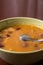 Closeup macro angle of cooked beans with sausages served in the bowl