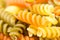 Closeup macro colored macaroni background