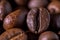 Closeup macro a group roasted brown or black coffee grains background