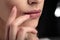 Closeup macro photo of woman`s lips with natural lip balm