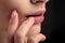 Closeup macro photo of woman`s lips with natural lip balm