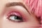 Closeup Macro of Pink Fashion Eye Make-up. Expressive Makeup, Bright Summer Eyeshadows, Magenta Color Hair, Shiny Skin