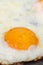 Closeup macro view of fried eggs in teflon frying pan