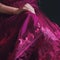 A closeup of a magenta dress with delicate lace trim and a full skirt. Trendy color of 2023 Viva Magenta.. AI generation