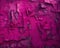 A closeup of a magenta wall with an eroded and abstract pattern that forms an unexpected and mesmerizing Trendy color of