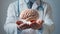 Closeup male doctor hands holding an artificial human brain as a scientific experiment of a laboratory. AI concept in medicine and