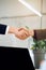 Closeup of male and female hands handshaking after effective negotiation showing mutual respect. Business concept.