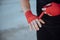 Closeup male hand of boxer with red boxing bandages