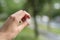 Closeup male hand holding hailstones after hailstorm